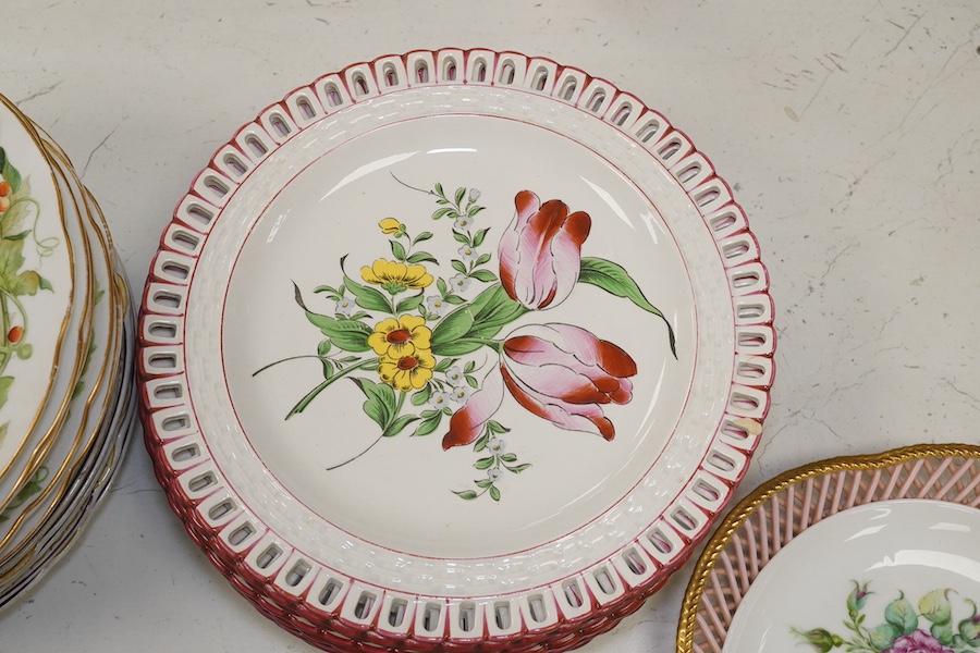 Ten French Luneville floral plates, a hand painted basket edged plate and various part dinner service plates, 24cm in diameter. Condition - mostly fair to good